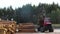 Loading logs with a manipulator in a truck, work at a sawmill, sawmill, working process, transporting logs