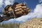 Loading logs with a special loader.Timber products warehouse on a specialized site