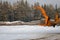 Loading lumber. Forest logs, unload the tractor. Forest industry.