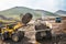 Loading of mountain soil into a dump truck bucket