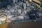 Loading and unloading coal on ship terminal sea cargo port, industrial background, aerial top view