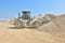 Loading the wheel dozer at concrete plant