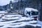 Loading wood onto a truck in the forest in winter