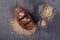 A loaf of black bread lies next to the bags