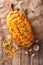 loaf of bread baked with cheddar cheese, garlic and herbs closeup. Vertical top view