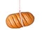 A loaf of bread hanging on a measuring tape