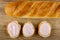 Loaf of bread, sandwiches with fruit cottage cheese on table. Top view