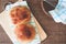 Loaf of bread on wood background with bakery tools, flat lay, closeup