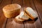 A loaf of delicious white bread made from natural products, on hops with flax saturation, without baker`s yeast, on a wooden tabl