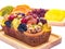 A loaf of fruit cake in wooden plate