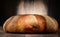 Loaf of large bread on wooden table