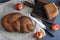 loaf with poppy seeds and half of the bread taken closeup - apples and knife