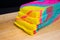 A loaf of rainbow bread on wood cutting board