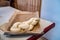 Loaf of raw uncooked swiss zopf dough braided and sitting on a stainless steel tray