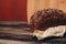 a loaf of rye bread on paper coasters and a board in the background of a wooden table