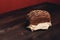 a loaf of rye bread on paper coasters and a board in the background of a wooden table