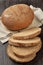 A loaf of rye-wheat bran bread with slices