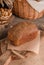 Loaf of traditional rye bread on wooden background