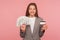 Loan, cash deposits. Portrait of happy smiling elegant businesswoman in suit jacket holding dollar banknotes and credit card