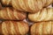 Loaves of bread in a bakery. Variety of breads displayed on shelves in bakery