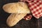 Loaves of Fresh French Baguette on a Rustic Wooden Table