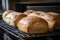 loaves of freshly baked bread, ready to be enjoyed with butter and jam