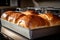 loaves of freshly baked bread, ready to be enjoyed with butter and jam