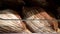 Loaves of rye farm bread lie on the wooden bakery shelf. Close-up shot. Shopping at the grocery store. Selling food