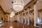 The lobby of the Milan Opera Theater La Scala with beautiful chandeliers and celebrity busts