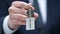 Lobbying word on keychain in male politician hand, governmental influence