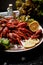 A lobster on a big Golden platter.Scatter the lemon and the Bay leaf.Restaurant food.