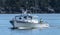 Lobster fishing boat heading into port in Bar Harbor Maine