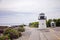 Lobster point lighthouse along the rocky coast of Maine on the Marginal Way path in Ogunquit