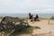 Lobster pot and people by Thurlestone rock Devon.