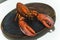 Lobster, ready to be prepared on a plate. Inspiration for young chefs. High quality photo.