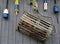 Lobster trap and colorful buoys on gray wall