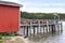 Lobster traps and buoys on wooden pier