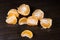 Lobules of mandarin on dark wooden table