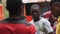 Local African singer sings songs into a microphone at an African wedding, Zanzibar