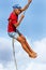 Local boy swinging on a rope swing in Lavena village on Taveuni