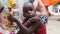 Local Brazen Starving African Boy Looking at Camera and Waving Hands, Zanzibar