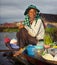 Local Cambodian seller in floating village.