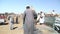 Local camel salesmen on Camel market loading camels to trucks.