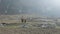 Local farmers carry heavy wicker baskets on the heads in Nepal. Manaslu area.