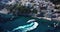 A local ferry arrives in the city, view of docked yachts and boats anchoring