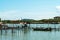 A local fisherman village standing in the water. Traditional colorful asian wooden fishing boats in village. River view