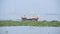 Local Fishermen On Traditional Wooden Fishing Boat Travelling In Fort Kochi In Kerala, India. - med