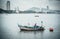 Local fishermen unload their nets on a boat at Bang Phra Beach, Thailand