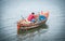 Local fishermen unload their nets on a boat at Bang Phra Beach, Thailand