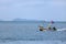 Local fishing boat with long-tail engine running in the sea